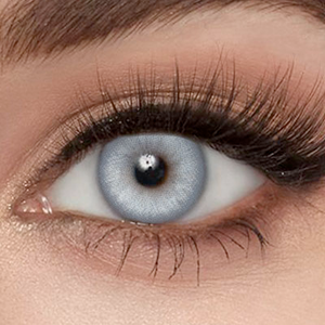 Model wearing Gemflare Blue Contact Lenses 14.2mm natural bright blue look